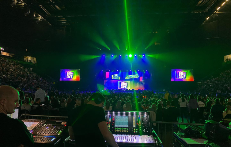 Drew working the lighting console at a concert